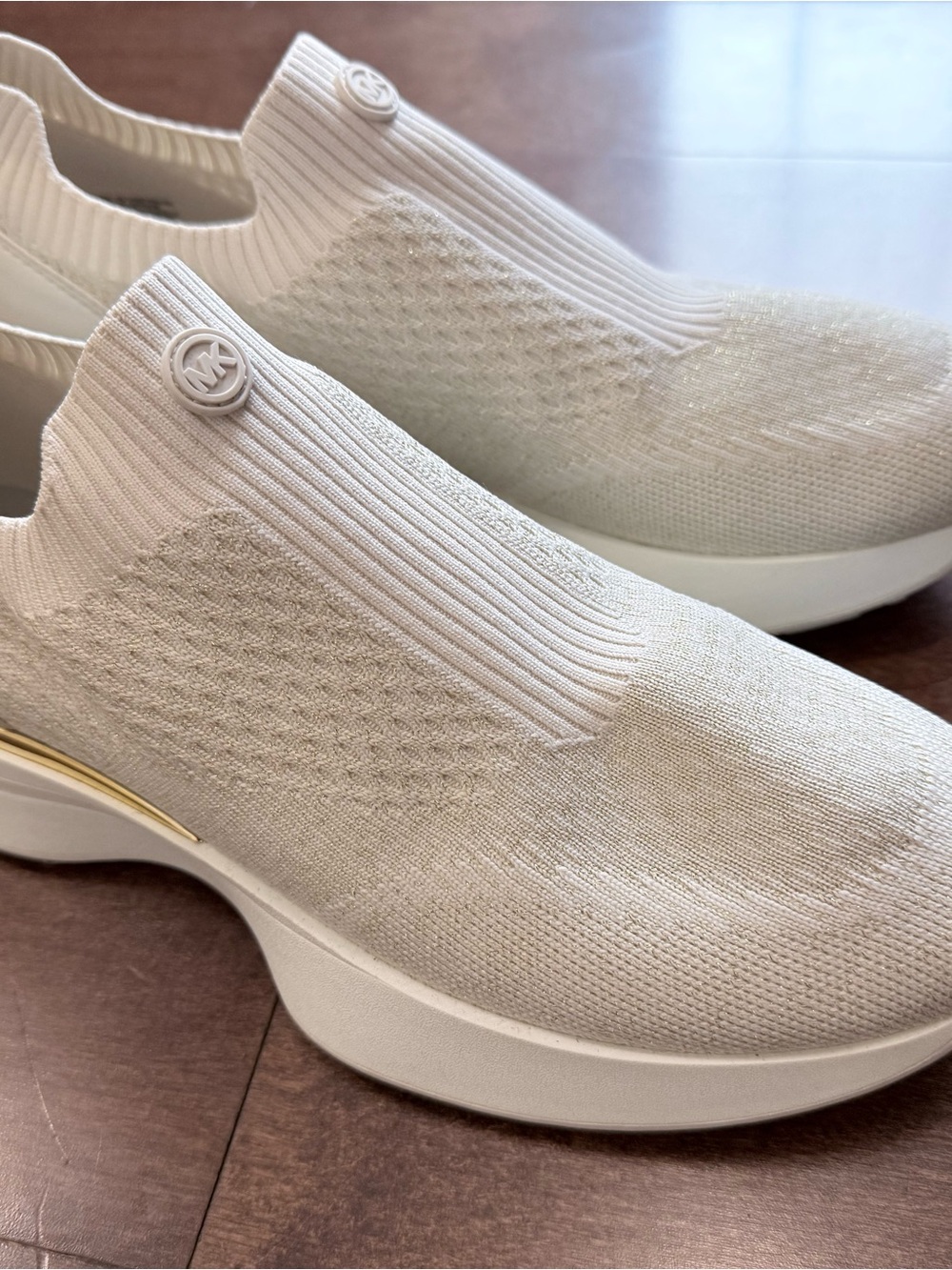 Michael Kors Women's White Slip-On Knit Sneakers with gold accent